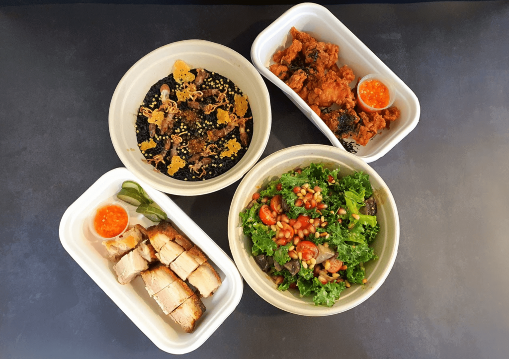 The Spread food showcase with pork belly, kale salad and squid ink risotto
