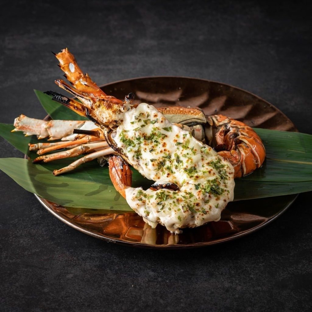 A large flame-seared king prawn with creamy sauce from Aburi-EN at VivoCity
