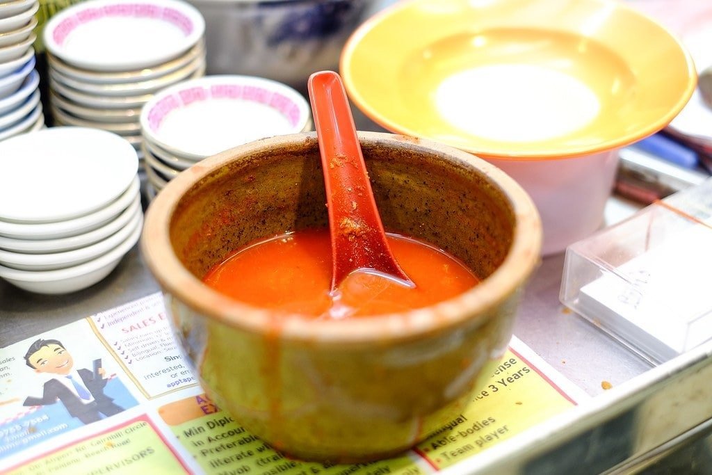 A pot of signature red chili sauce at Lim's Fried Oyster hawker stall