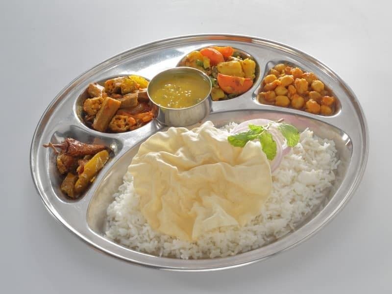 A stainless steel thali platter from Pangat