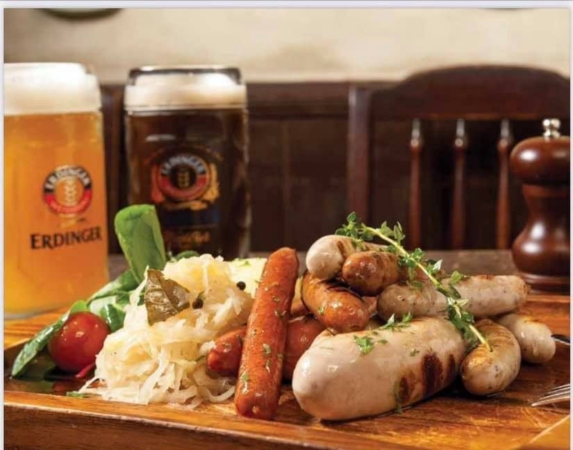 A hearty German sausage platter from Baden Restaurant & Pub on a wooden board