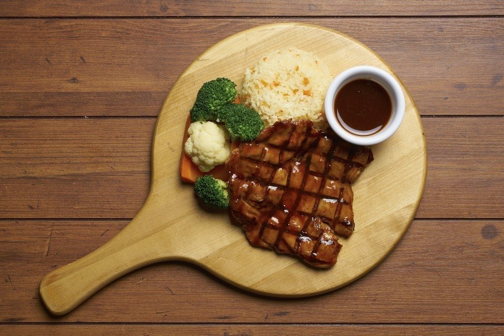 Top-down view of a grilled chicken meal from Buddy Hoagies Steak & Grill Restaurant