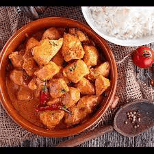 a picture of chicken curry with rice