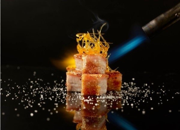close-up shot of Crystal Jade Hong Kong Kitchen's crispy roasted pork belly cubes