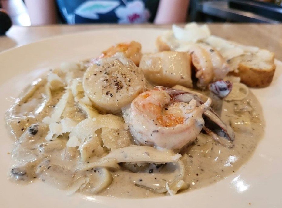 Close-up of a creamy seafood pasta dish from District 10 Bar & Grill