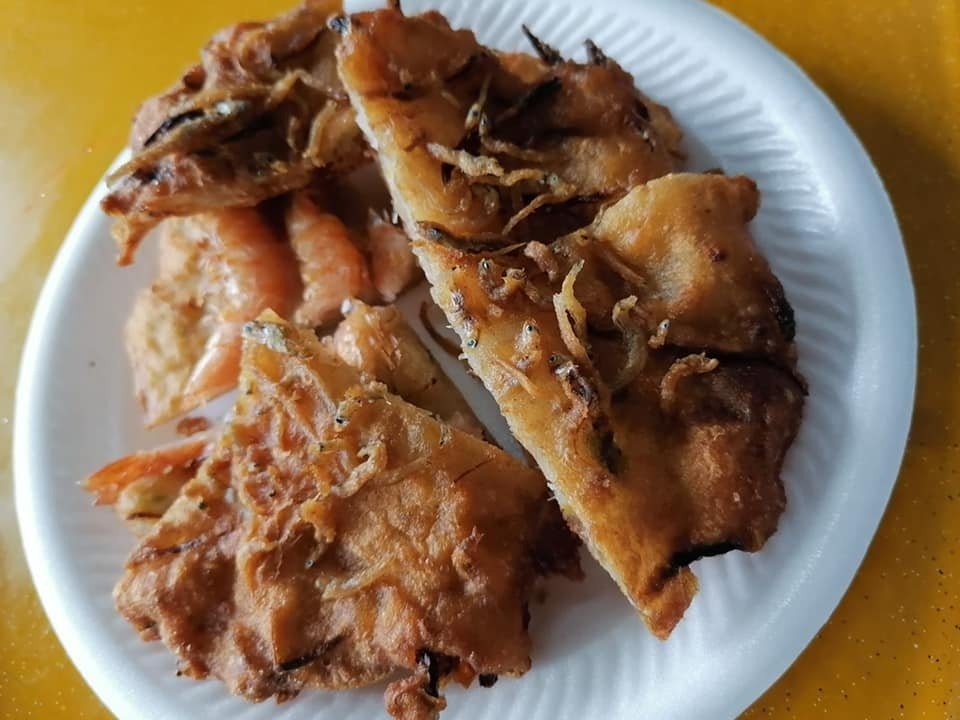 Close-up of golden-brown prawn and anchovy fritters from Ga-Hock Seafood