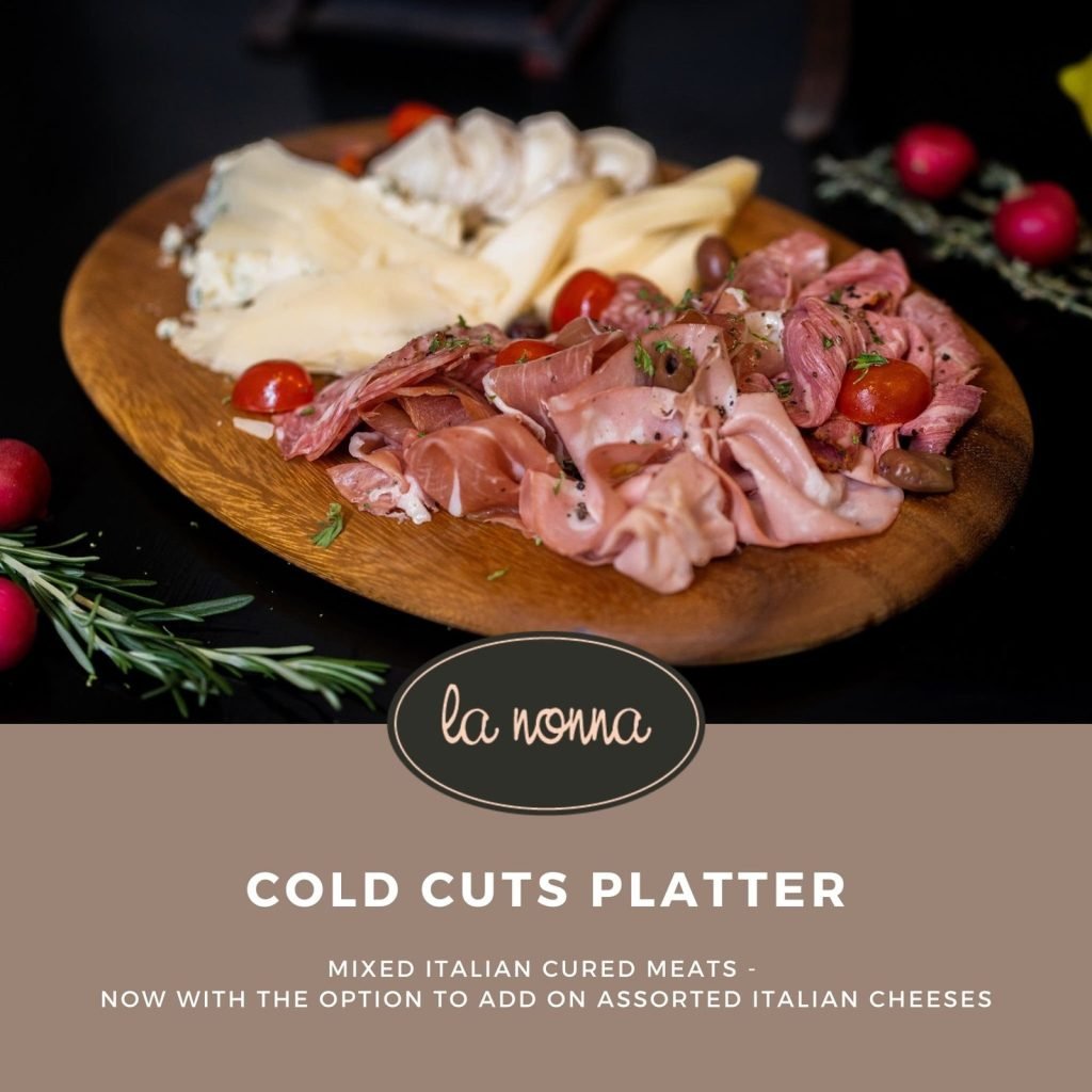 Promotional image for 'la nonna' featuring a wooden platter of Italian cold cuts and assorted cheeses