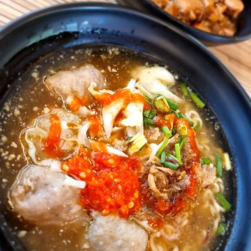 Close-up of a black bowl of Bakso from Makan Empire