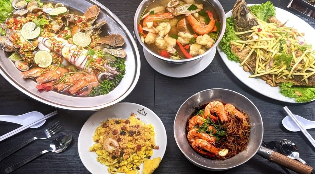 Overhead view of a Thai seafood feast from Nakhon Kitchen
