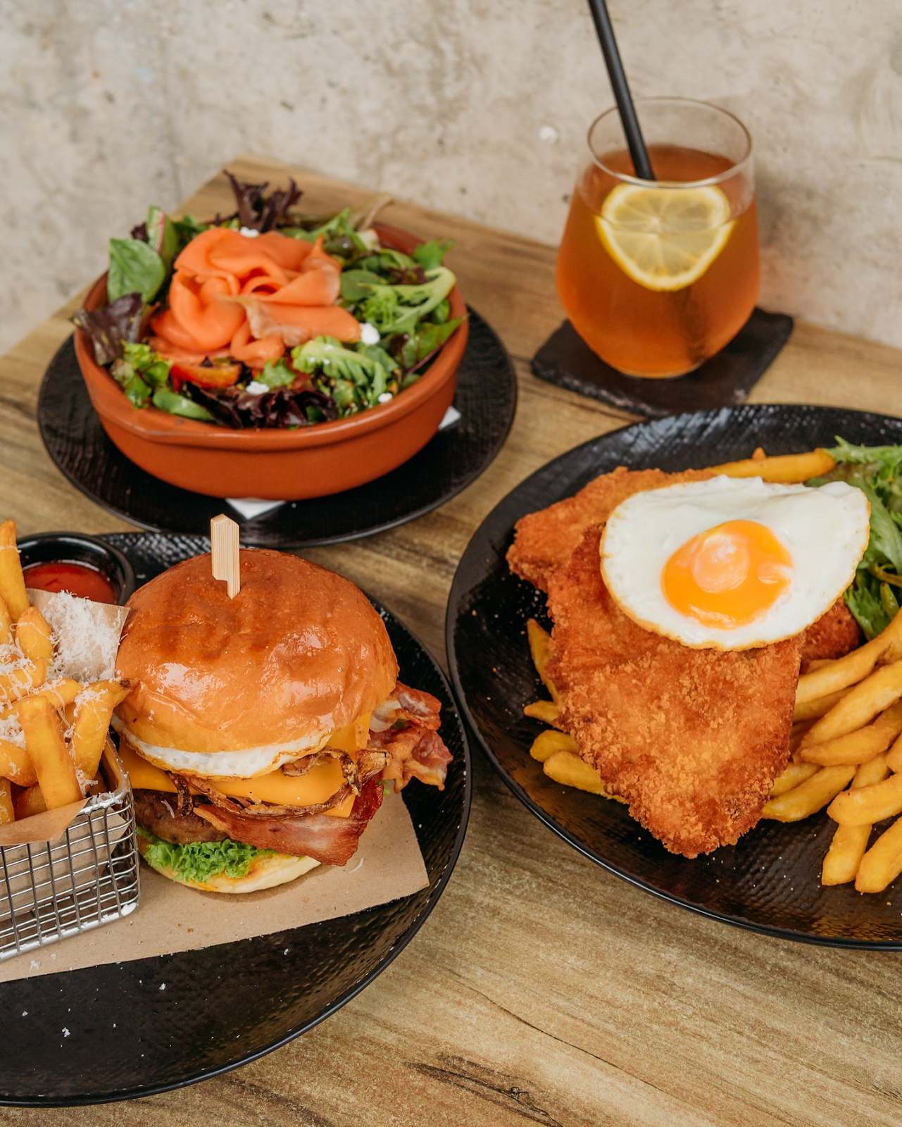 a picture of 3 meals which include burger set, chicken chop amd salad