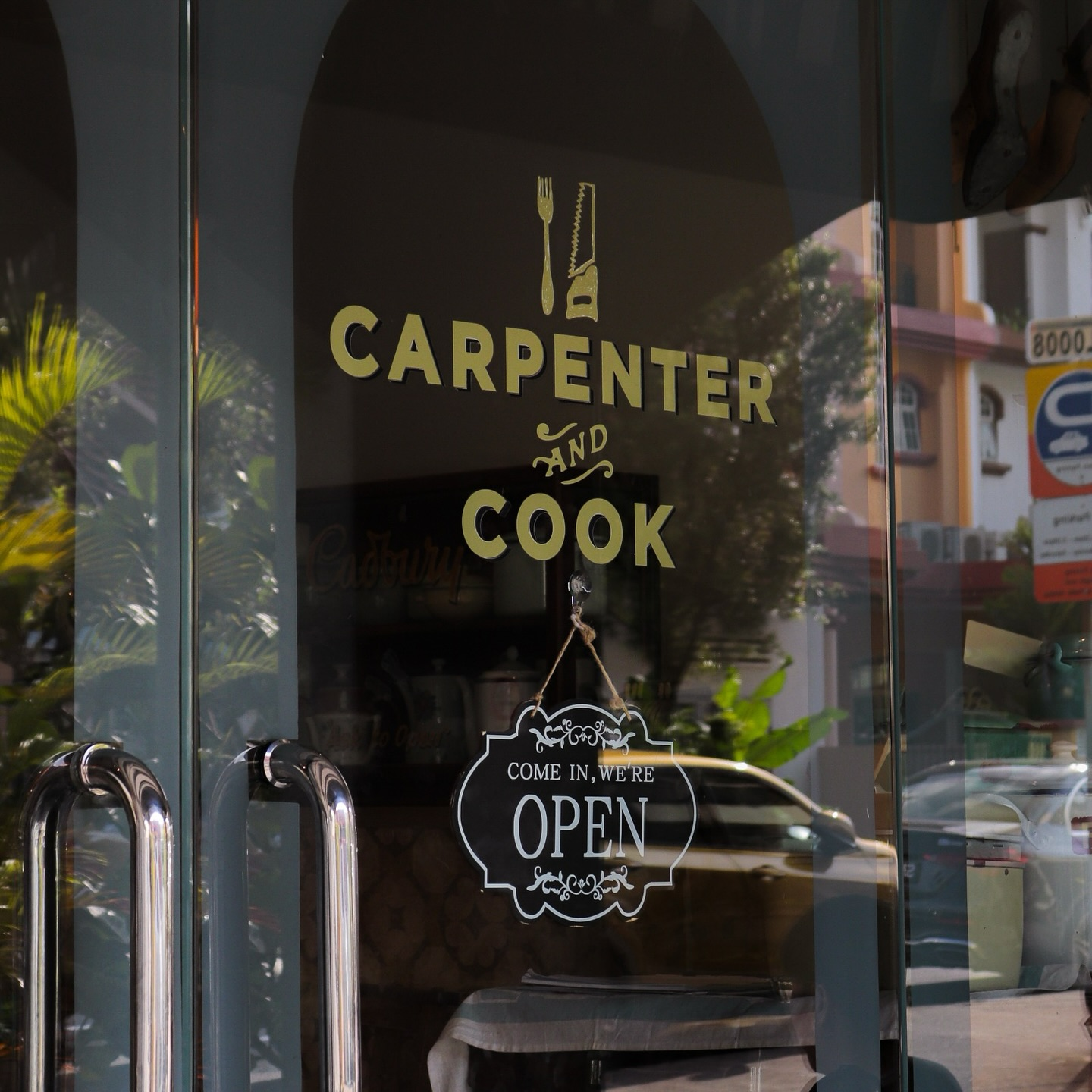 Glass door of the 'Carpenter and Cook' cafe in Bukit Timah