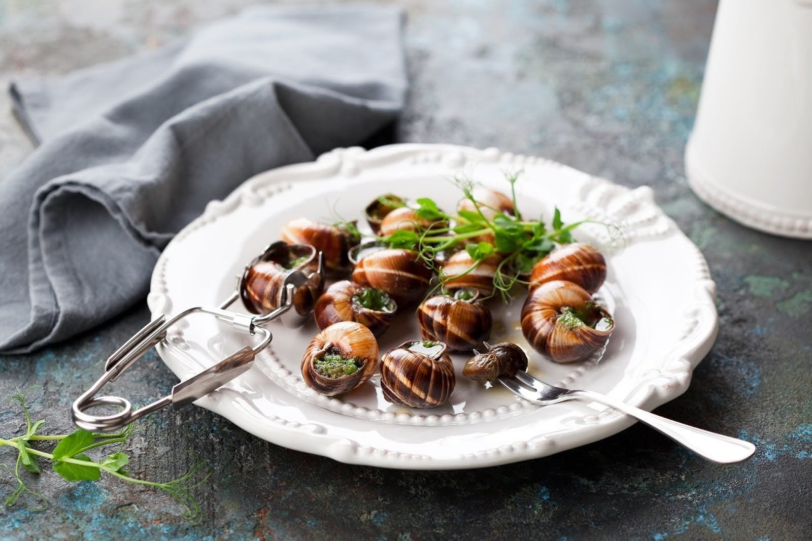 A plate of classic French escargot with garlic-parsley butter