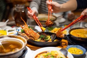 An appetizing, close-up shot of a communal Chinese seafood feast.