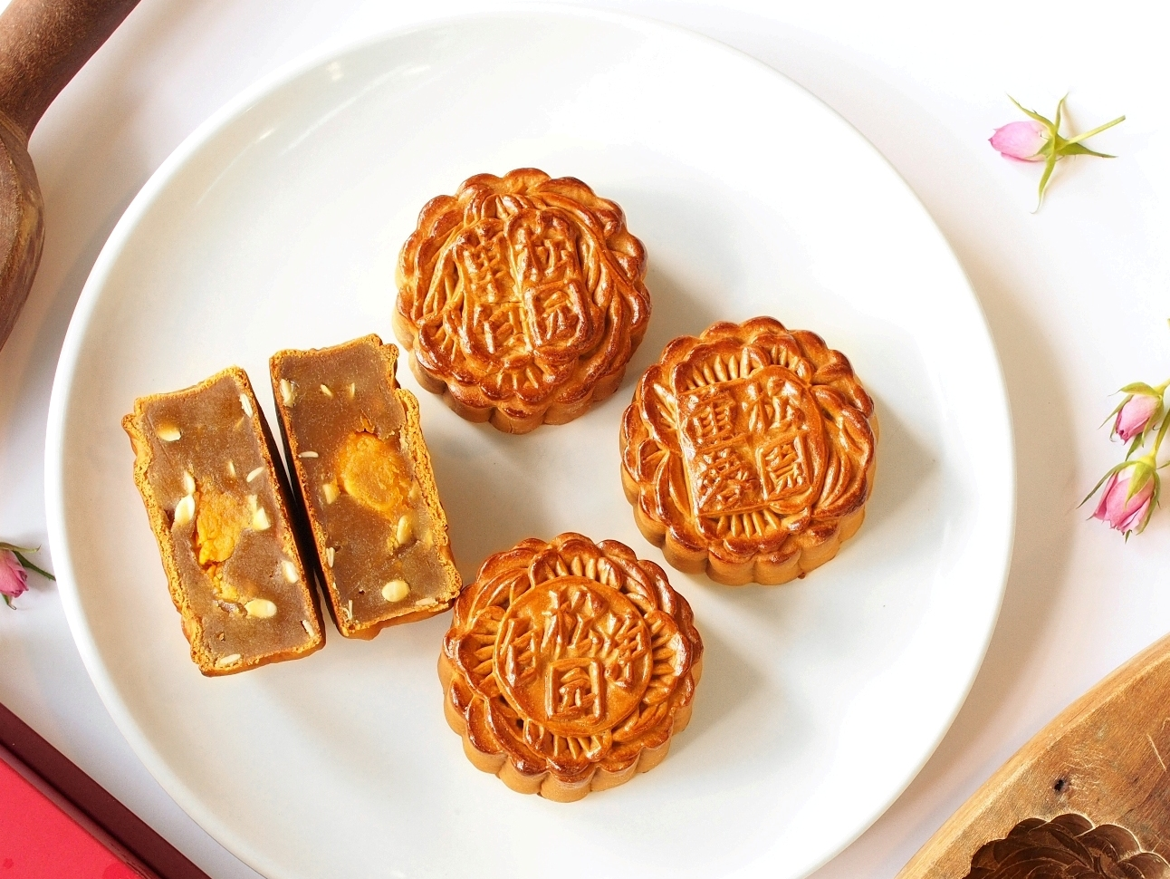 A close-up shot of The Pine Garden's traditional baked mooncakes on a white plate