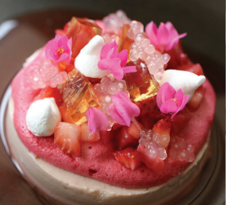 A close-up of a beautiful pink and white dessert from 2am: dessertbar