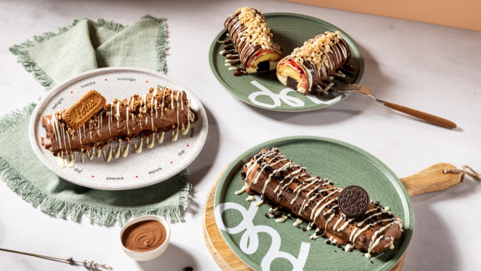 A beautifully styled photo of three plates of dessert crepes from dipndip