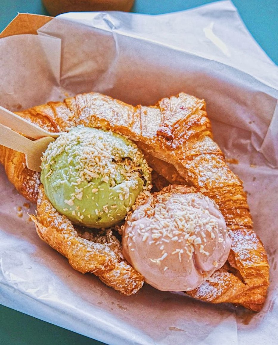 A fresh croissant from Madame Ooze, split open and filled with two scoops of ice cream