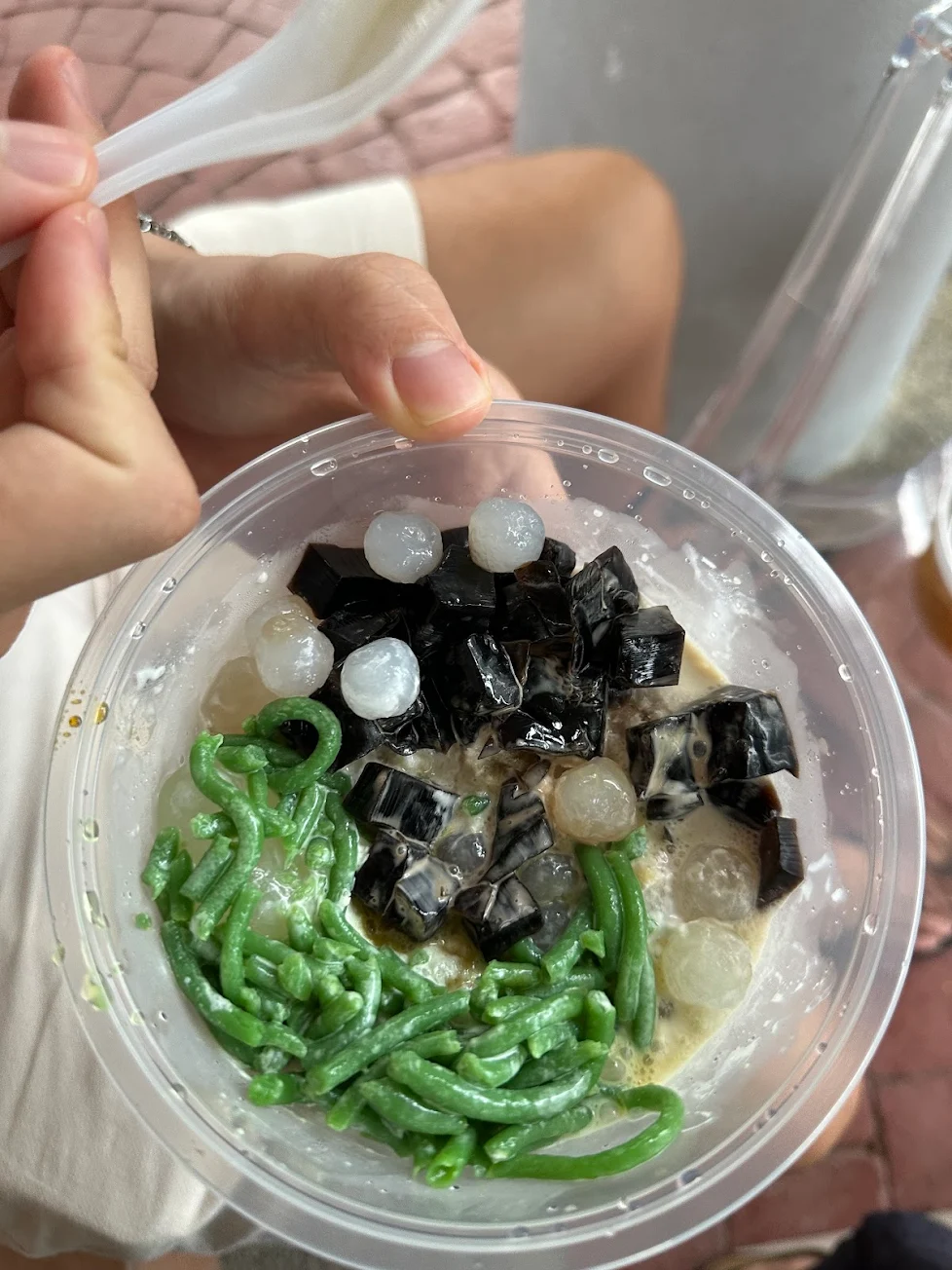 A person holding a bowl of chendol from No Name Dessert