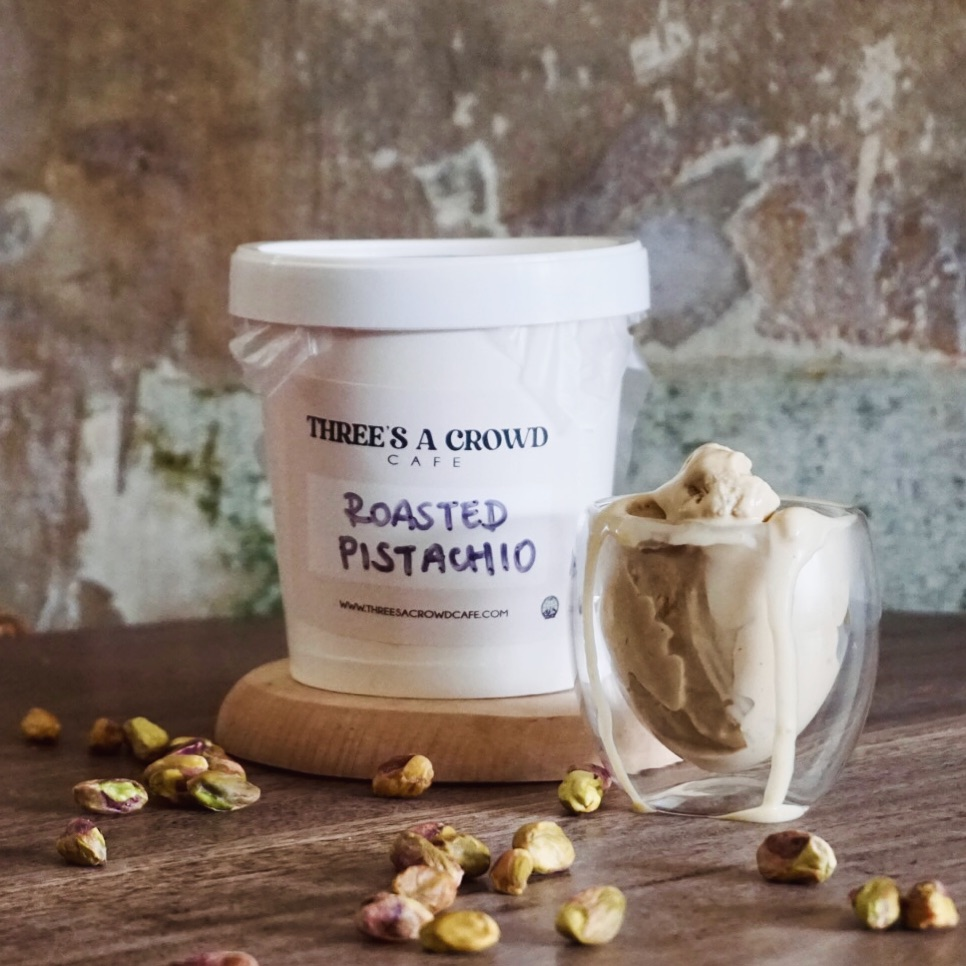 Roasted Pistachio' gelato from Three's a Crowd Cafe sits on a wooden surface