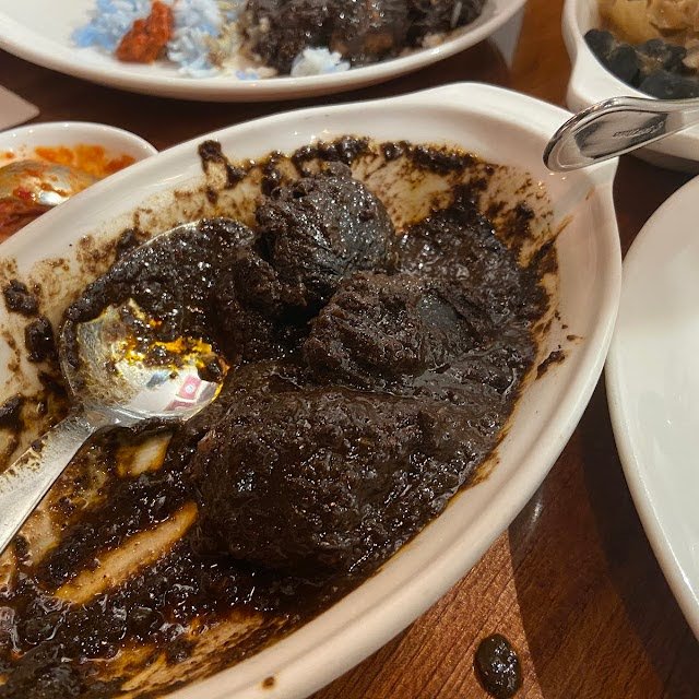 A serving of the signature Peranakan dish, Ayam Buah Keluak