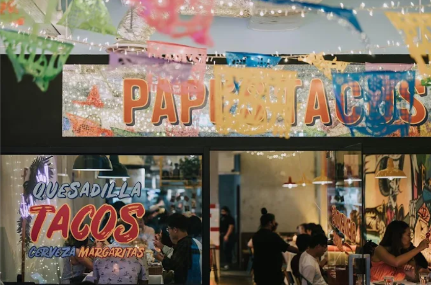 papi's tacos storefront with fiesta decorations