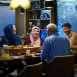 a muslim family having dinner at a restaurant