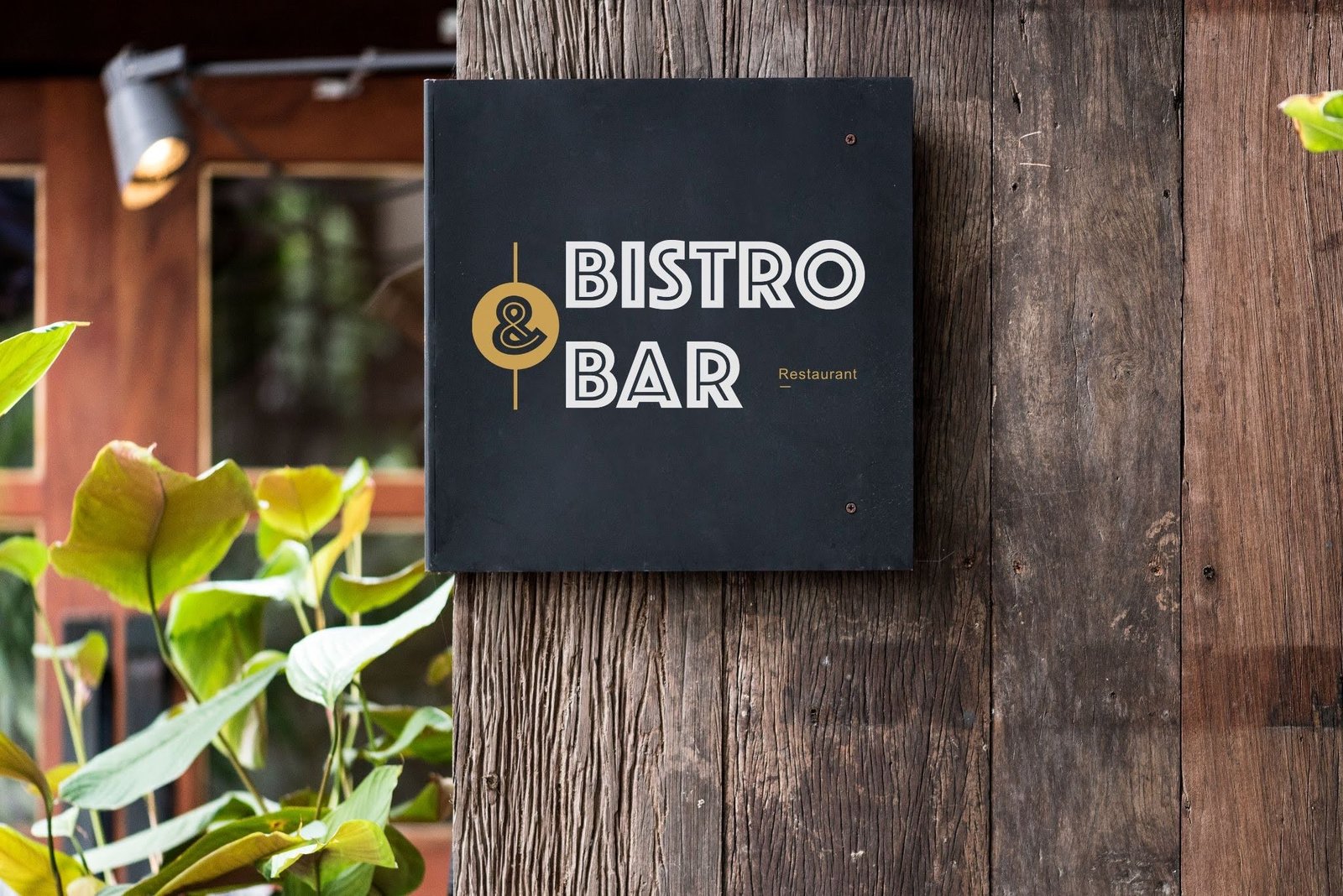 A modern minimalist Bistro & Bar sign mounted on a rustic wooden pillar