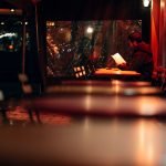 tables in a dimly lit cafe