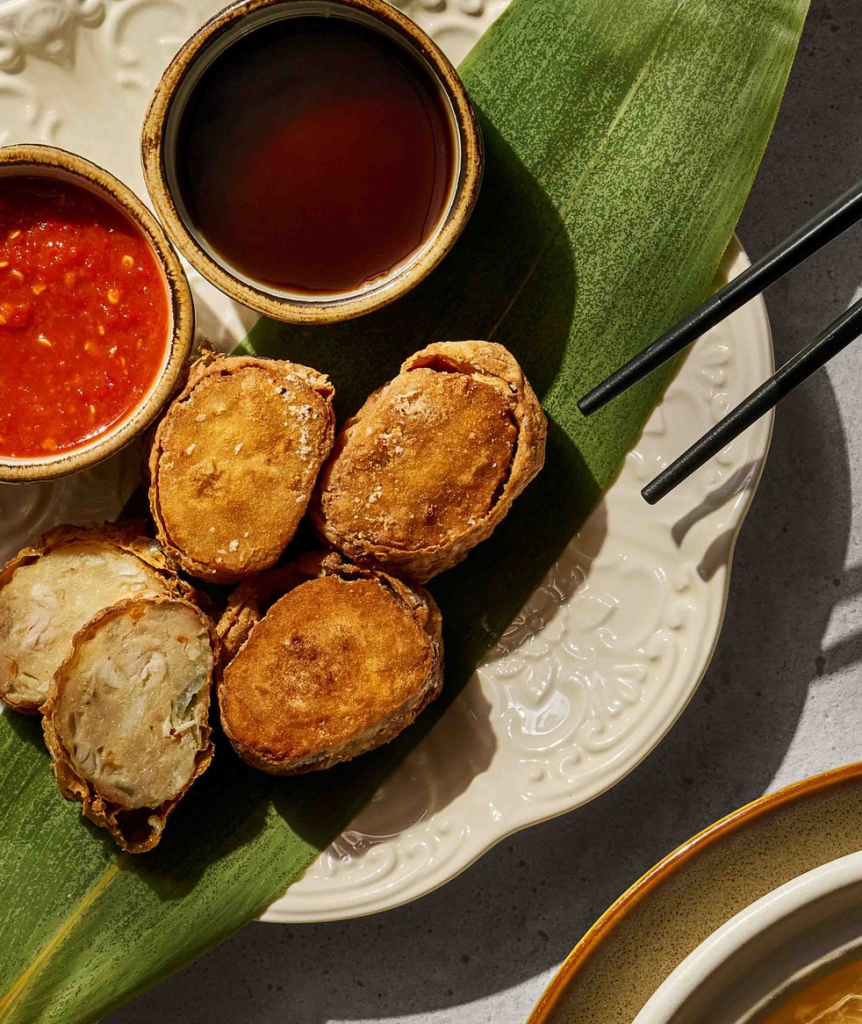 Crispy sliced ngoh hiang meat rolls served with sweet sauce and chili dip